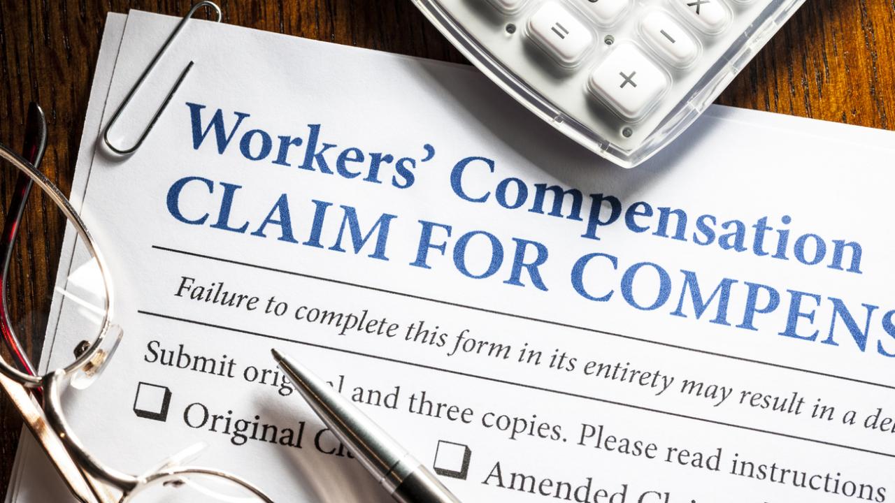 Image of a workers' compensation form on a desk.