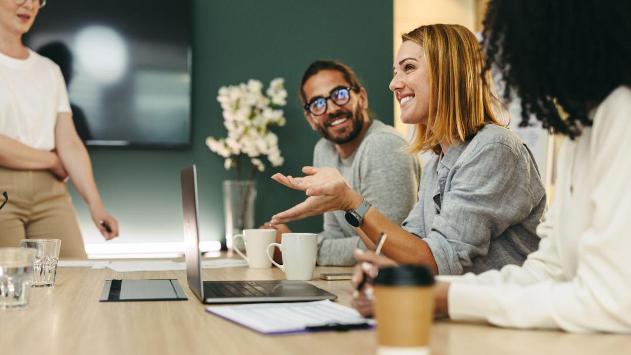 Image of a group of employees having a discussion. 