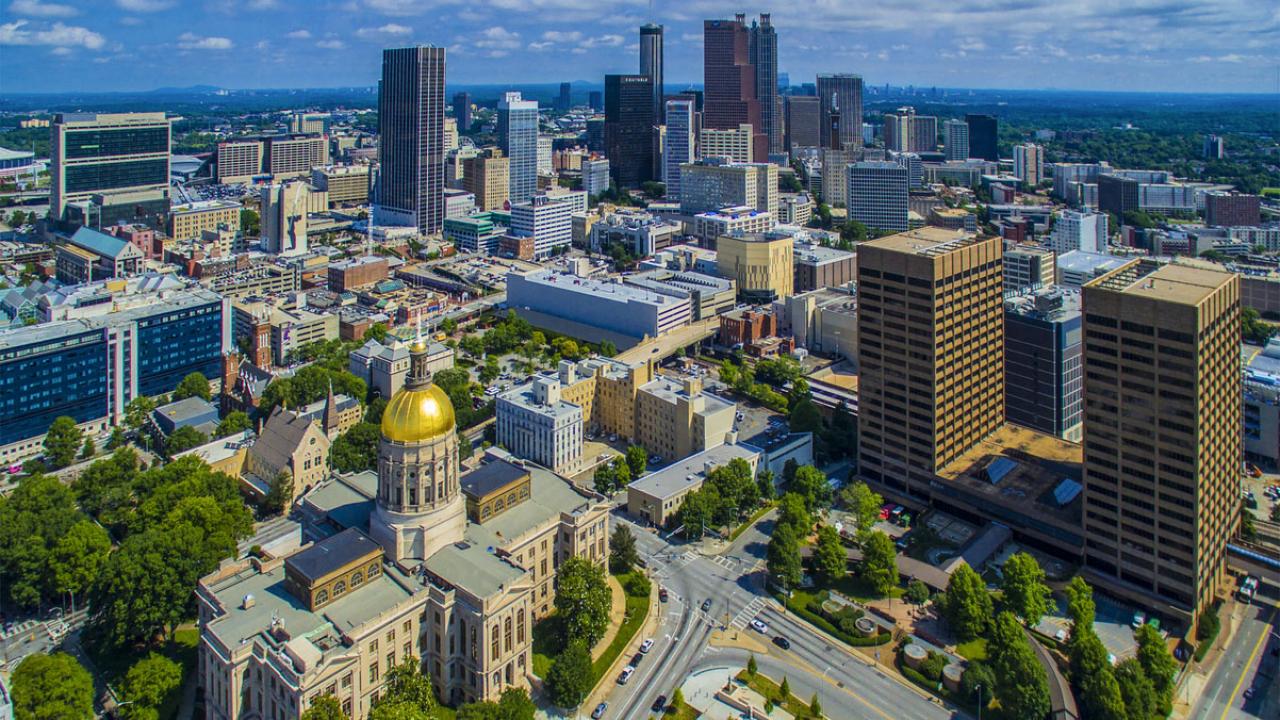 Image of the Georgia state capitol building and surrounding government buildings.