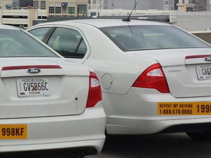 Image of a row of state of Georgia fleet vehicles.