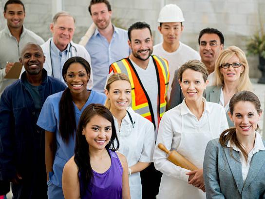 A group of state workers look up at the camera. 