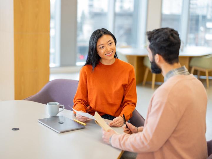 Image of a human resources manager meeting with an employee.