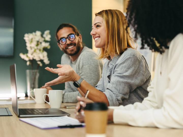 Image of a group of employees having a discussion. 