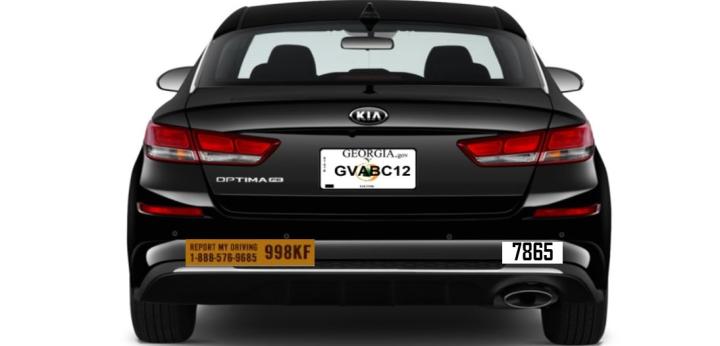 Image of a black sedan as seen from the rear. The number 7865 is prominently displayed on the passenger side of the bumper.  