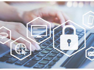 Hands on a keyboard. Several hexagonal icons are superimposed over the image.